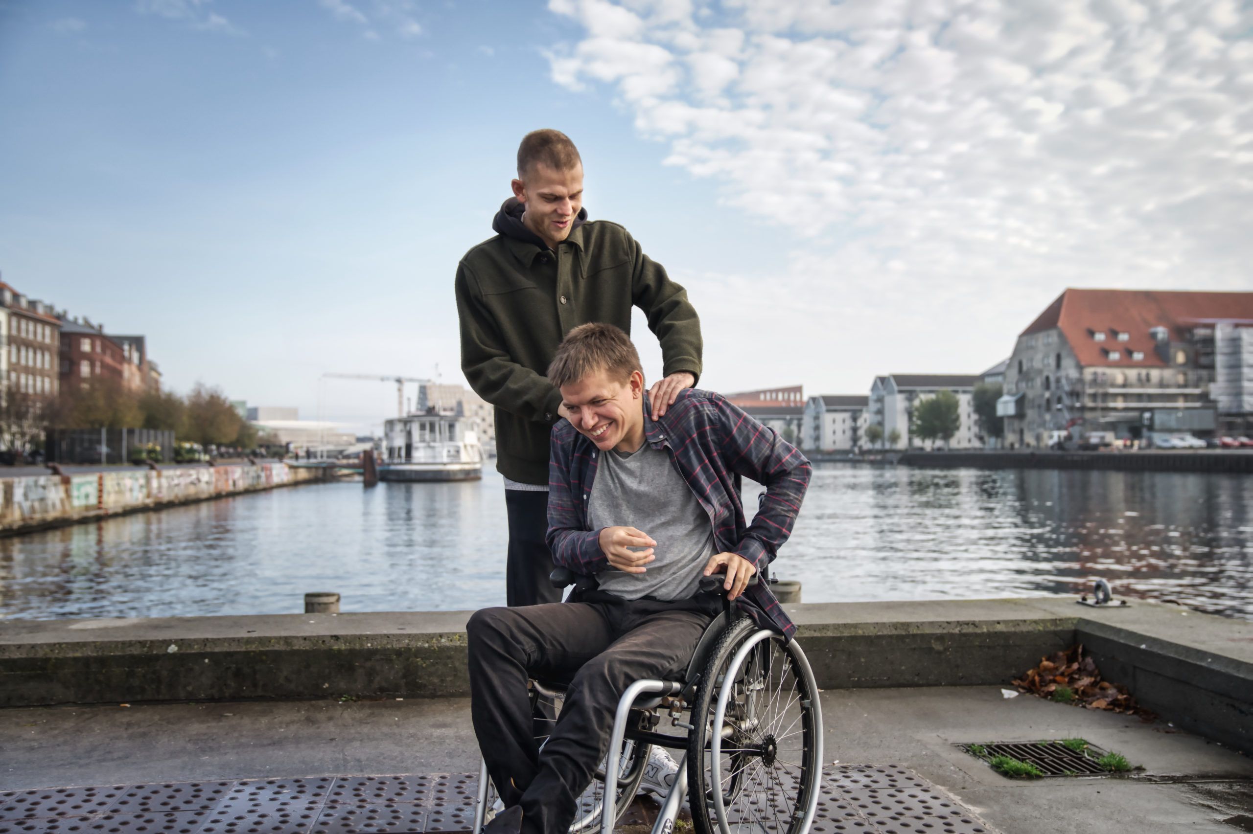 Young man with cerebral palsy and his caregiver